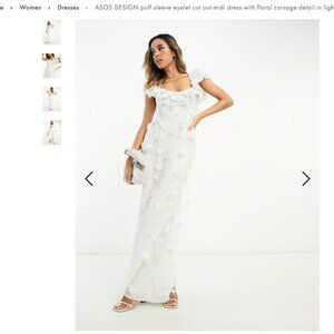 ASOS DESIGN puff sleeve eyelet cut out midi dress with floral corsage detail in